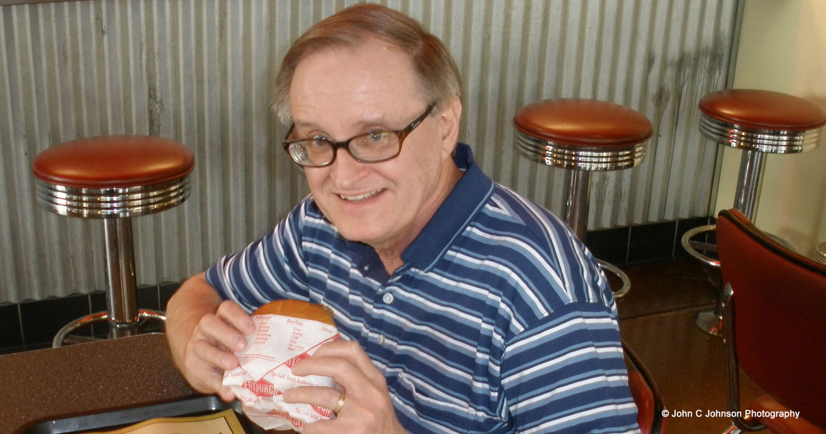 John enjoying a Fatburger